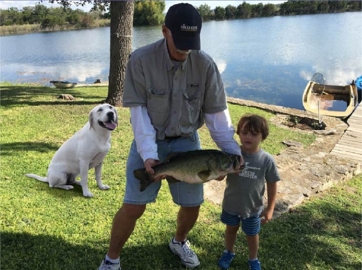 Lab-puppy-fishing-with-owner-and-grandson_2